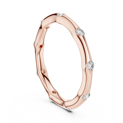 A Hand-Sculpted Wavy Band with Flush-Set Diamond Accents