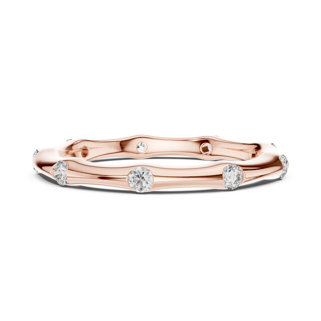 A Hand-Sculpted Wavy Band with Flush-Set Diamond Accents