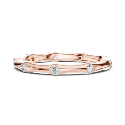 A Hand-Sculpted Wavy Band with Flush-Set Diamond Accents