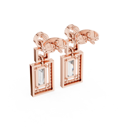 Elegant White Gold Drop Earrings Featuring Emerald Cut Diamonds