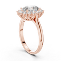 A Brilliant Round Diamond in a Sculptural Sunburst