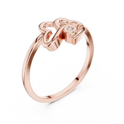 A Sculptural Double Heart Ring with a Radiant Diamond Accent