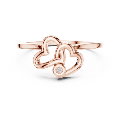 A Sculptural Double Heart Ring with a Radiant Diamond Accent