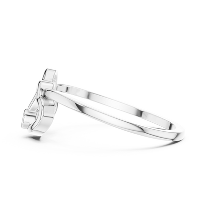 A Sculptural Double Heart Ring with a Radiant Diamond Accent
