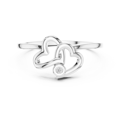 A Sculptural Double Heart Ring with a Radiant Diamond Accent
